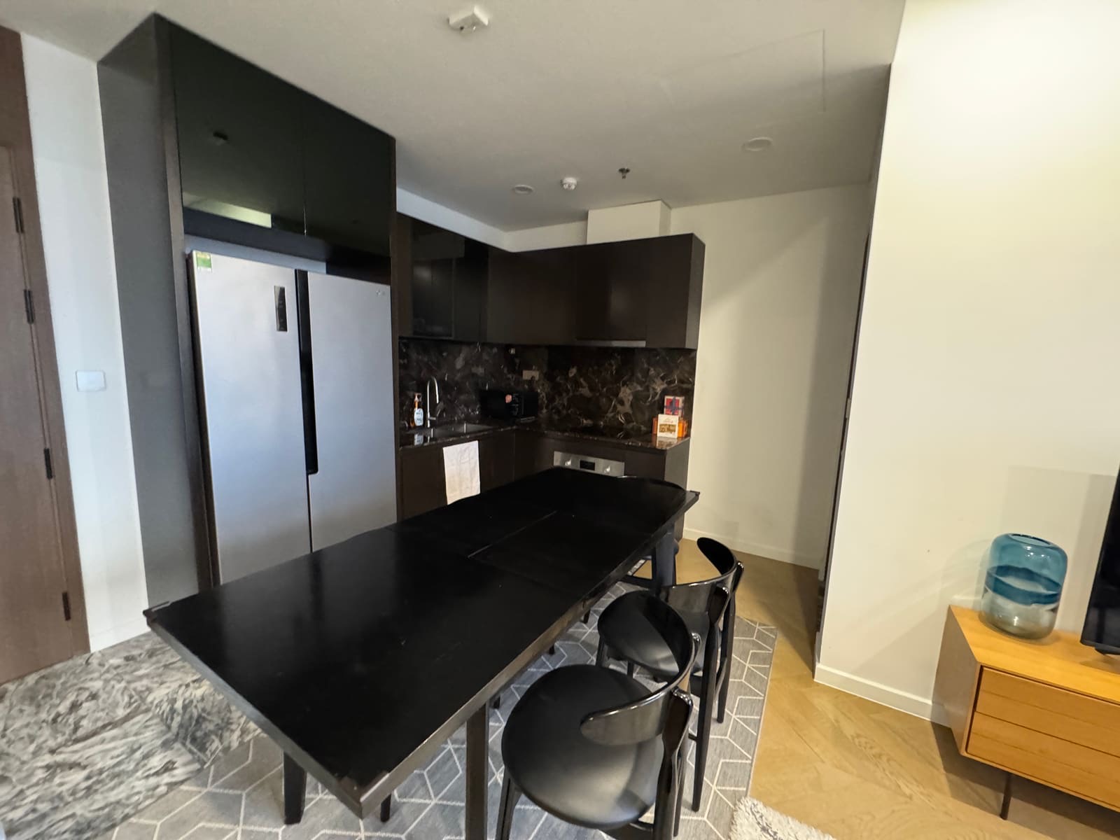 The full kitchen and dining table at the AIO Pad