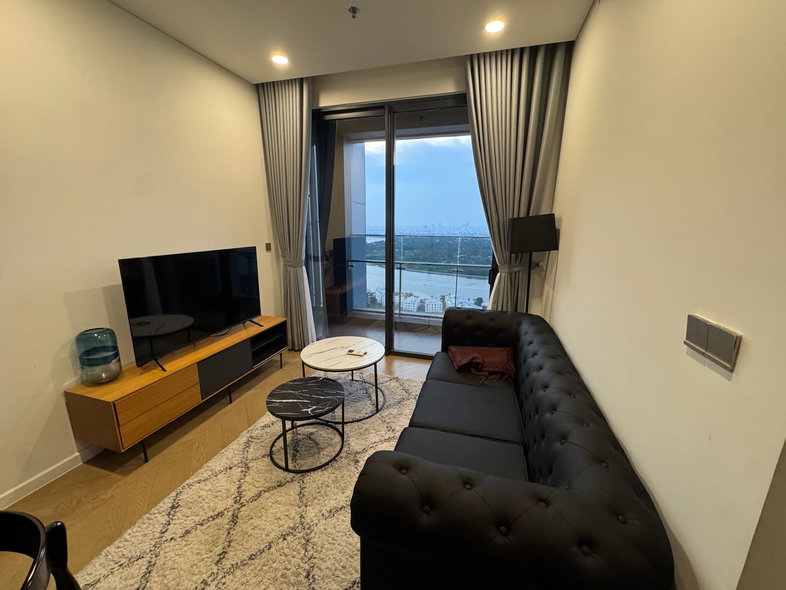 The AIO Pad living room with the river through the balcony doors